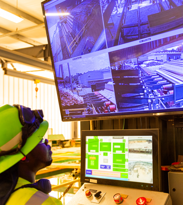 Man monitoring lumber yard